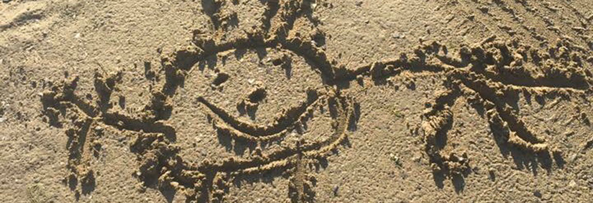 Sun drawn in the sand